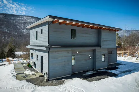 a front view of a house with parking