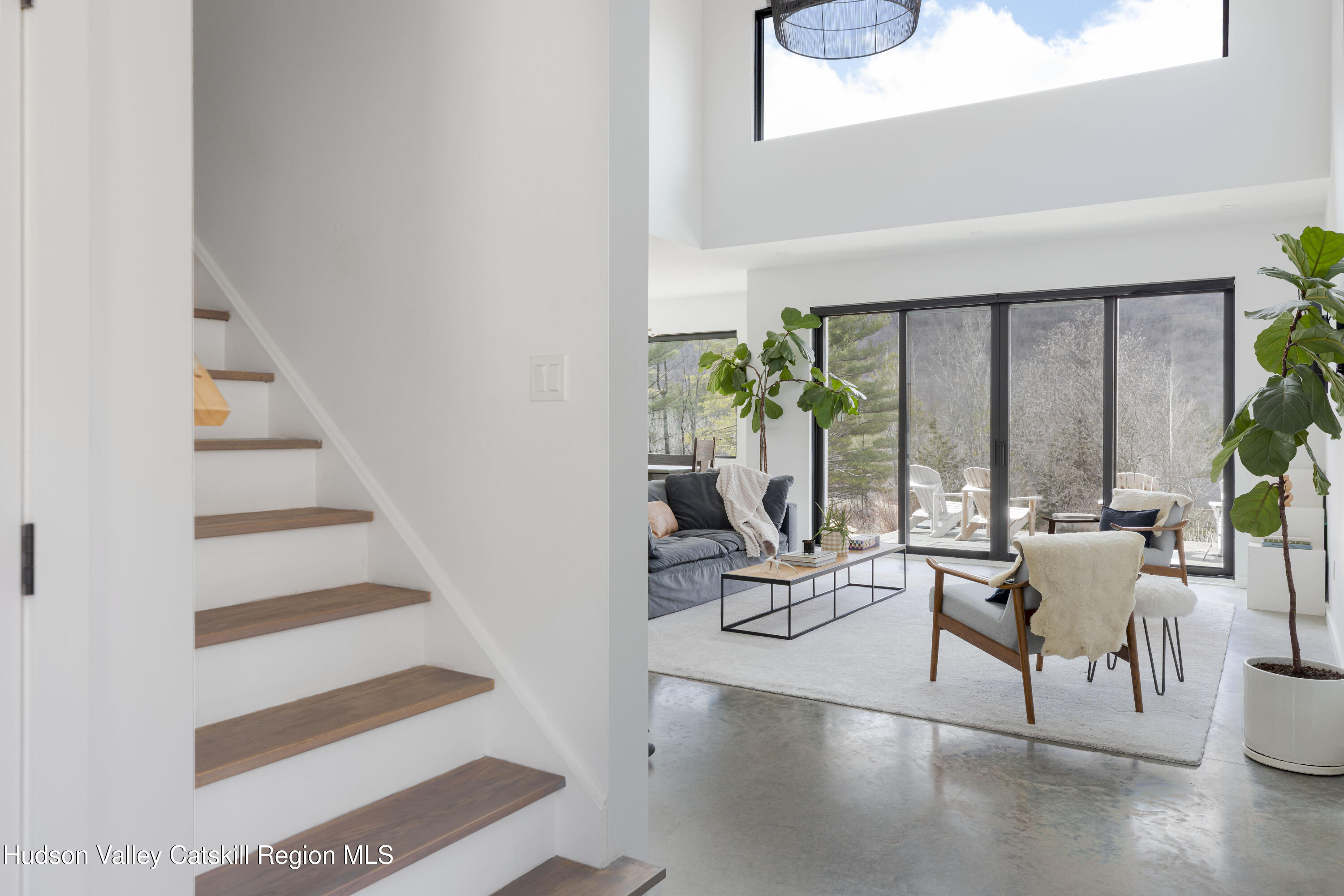 23 Traver Hollow Road Boiceville, NY 12412 - Photo 7 of 48 a living room with furniture and floor to ceiling windows