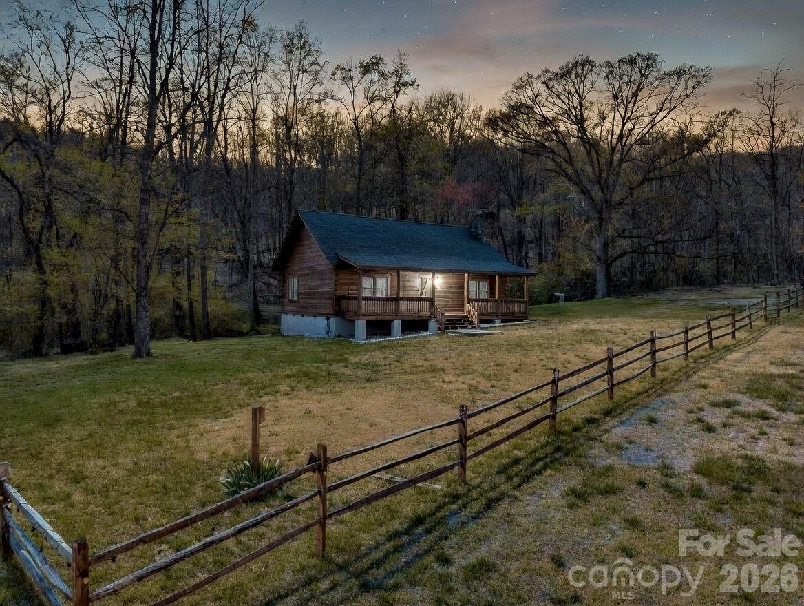 175 Pink Campbell Road Landrum, SC 29356 - Photo 4 of 48 a view of a yard with wooden fence