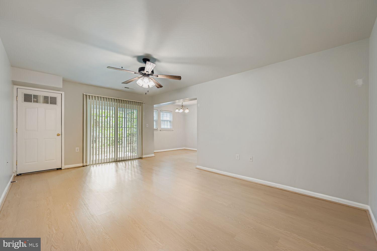 8385 Montgomery Run Road, Unit C Ellicott City, MD 21043 - Photo 2 of 11 wooden floor in an empty room with a window