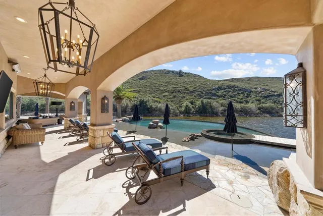 a view of a swimming pool with a patio