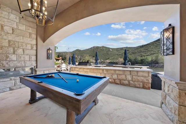 a view of a entryway door with palm trees