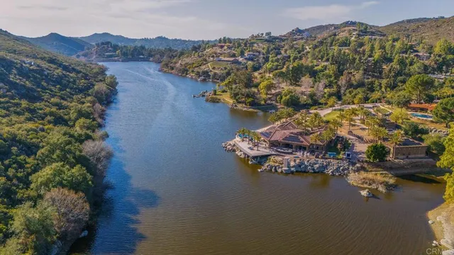 a view of a livingroom with furniture and a floor to ceiling window