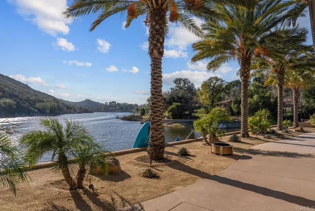 a living room with furniture fireplace and flat screen tv