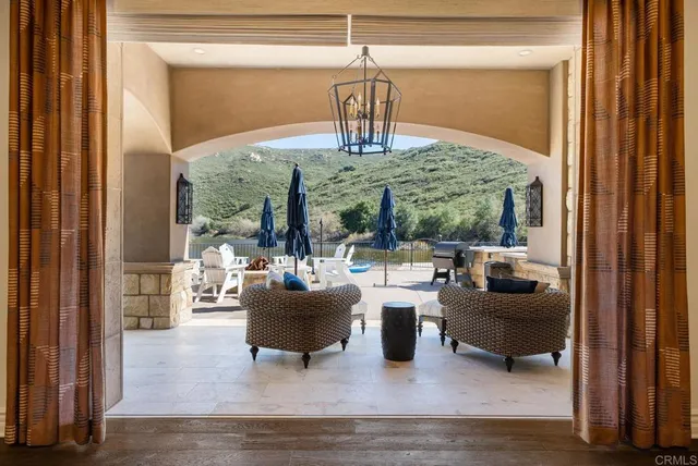 a balcony with table and chairs