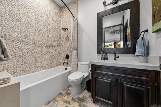 a bed room with a bed and a ceiling fan