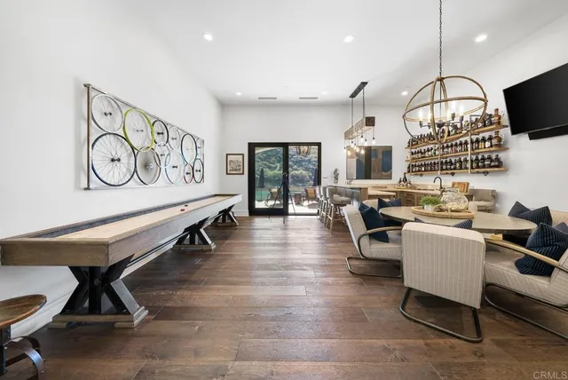 a view of a livingroom with furniture and a flat screen tv