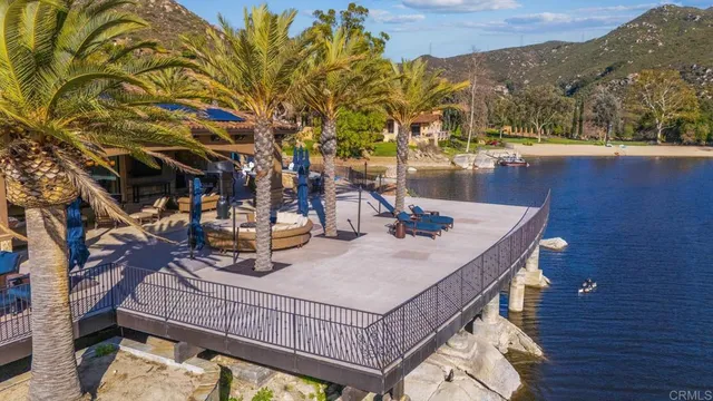 a living room with patio furniture and a large window