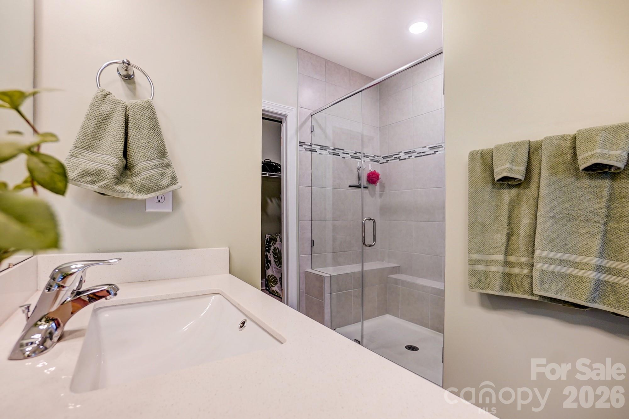 3925 Rothwood Lane Harrisburg, NC 28075 - Photo 27 of 48 a bathroom with a tub sink and shower