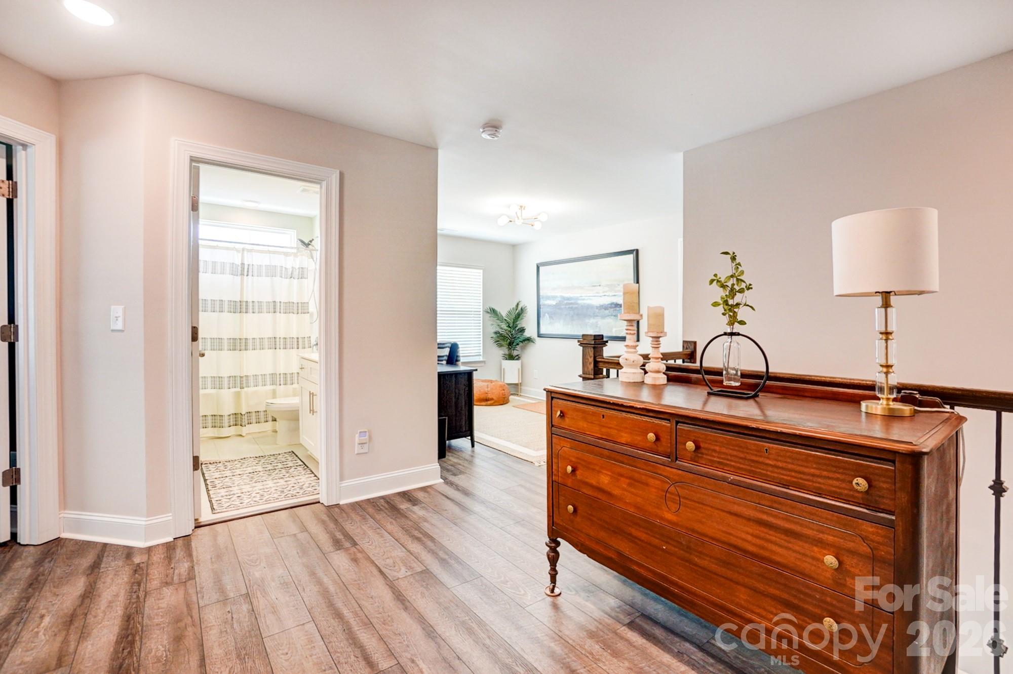 3925 Rothwood Lane Harrisburg, NC 28075 - Photo 29 of 48 a view of living room with furniture and wooden floor