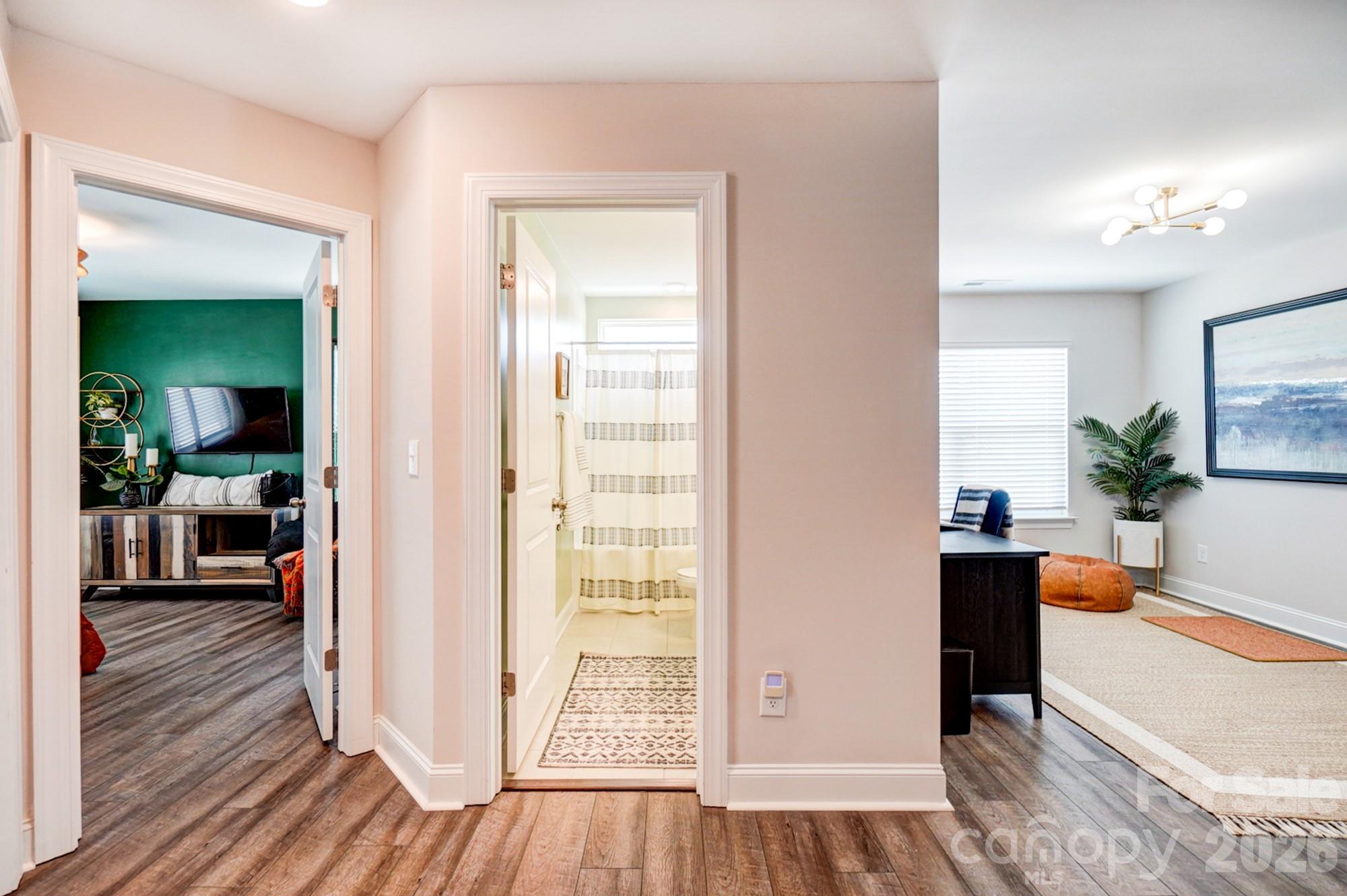 3925 Rothwood Lane Harrisburg, NC 28075 - Photo 30 of 48 a view of a living room and hardwood floor