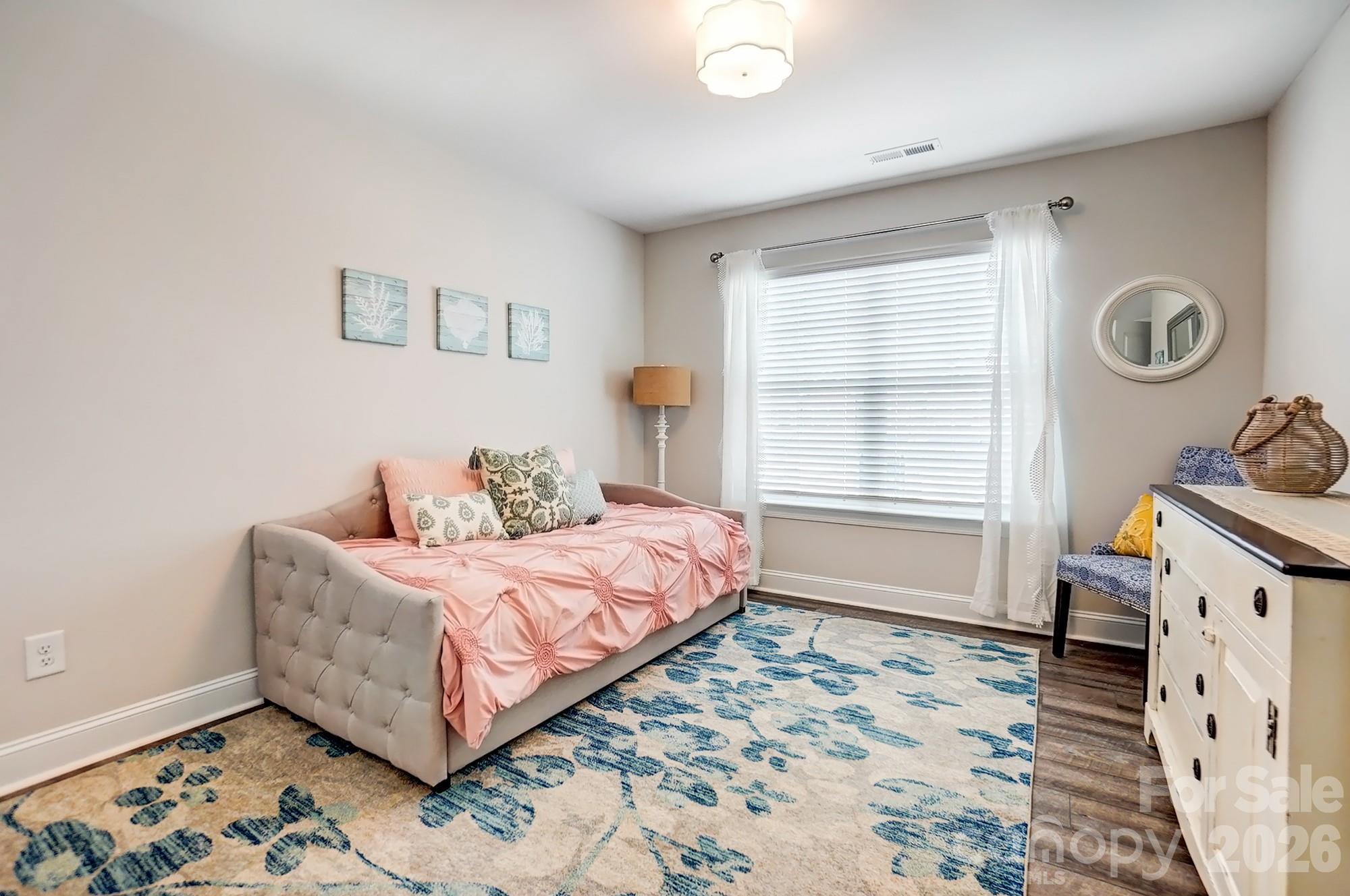 3925 Rothwood Lane Harrisburg, NC 28075 - Photo 35 of 48 a bedroom with a bed and a window