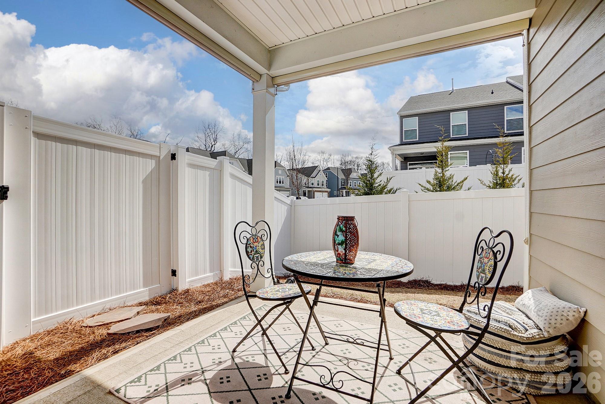 3925 Rothwood Lane Harrisburg, NC 28075 - Photo 47 of 48 a view of a dining room with furniture and a potted plant