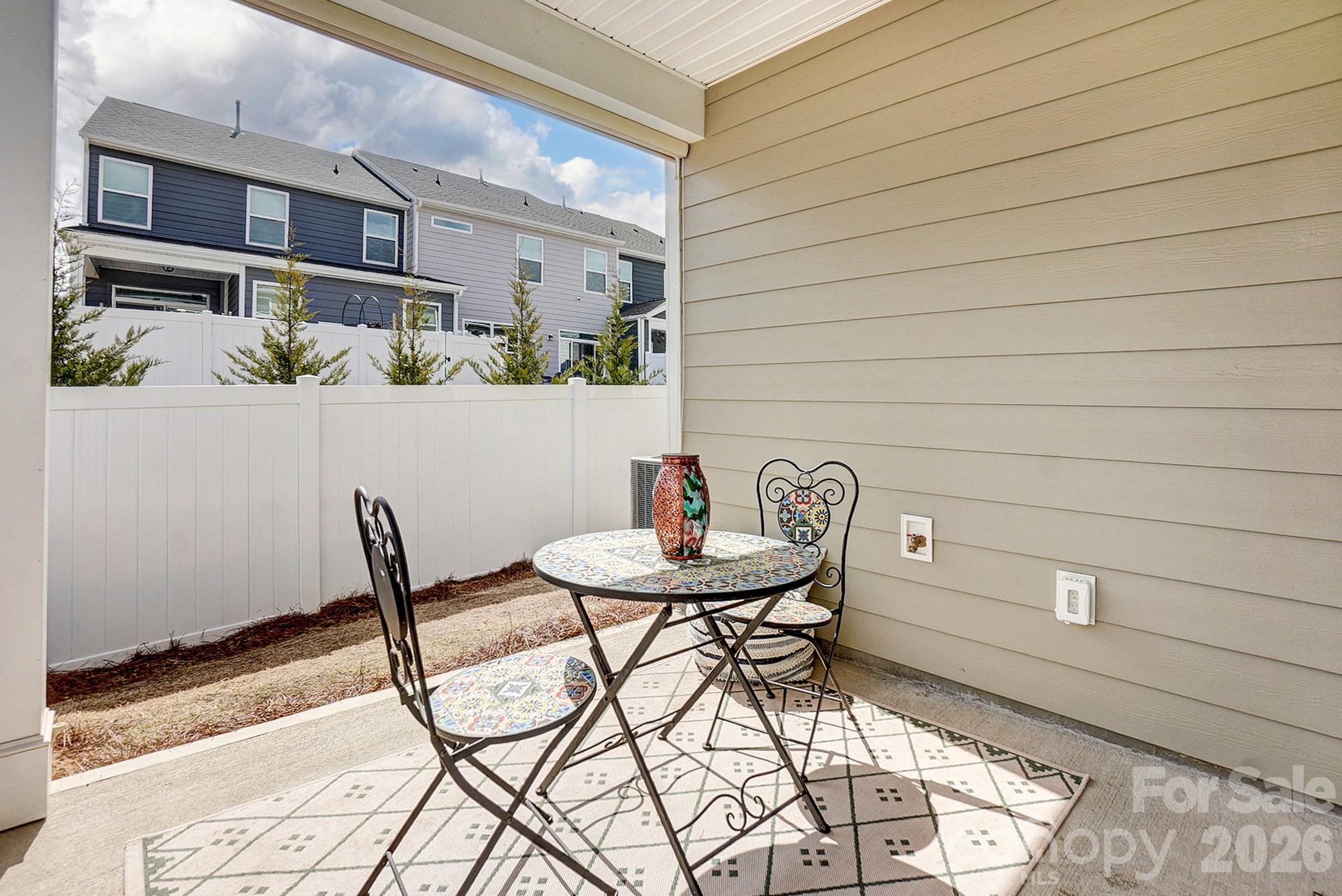 3925 Rothwood Lane Harrisburg, NC 28075 - Photo 48 of 48 a view of a chairs and table in a patio