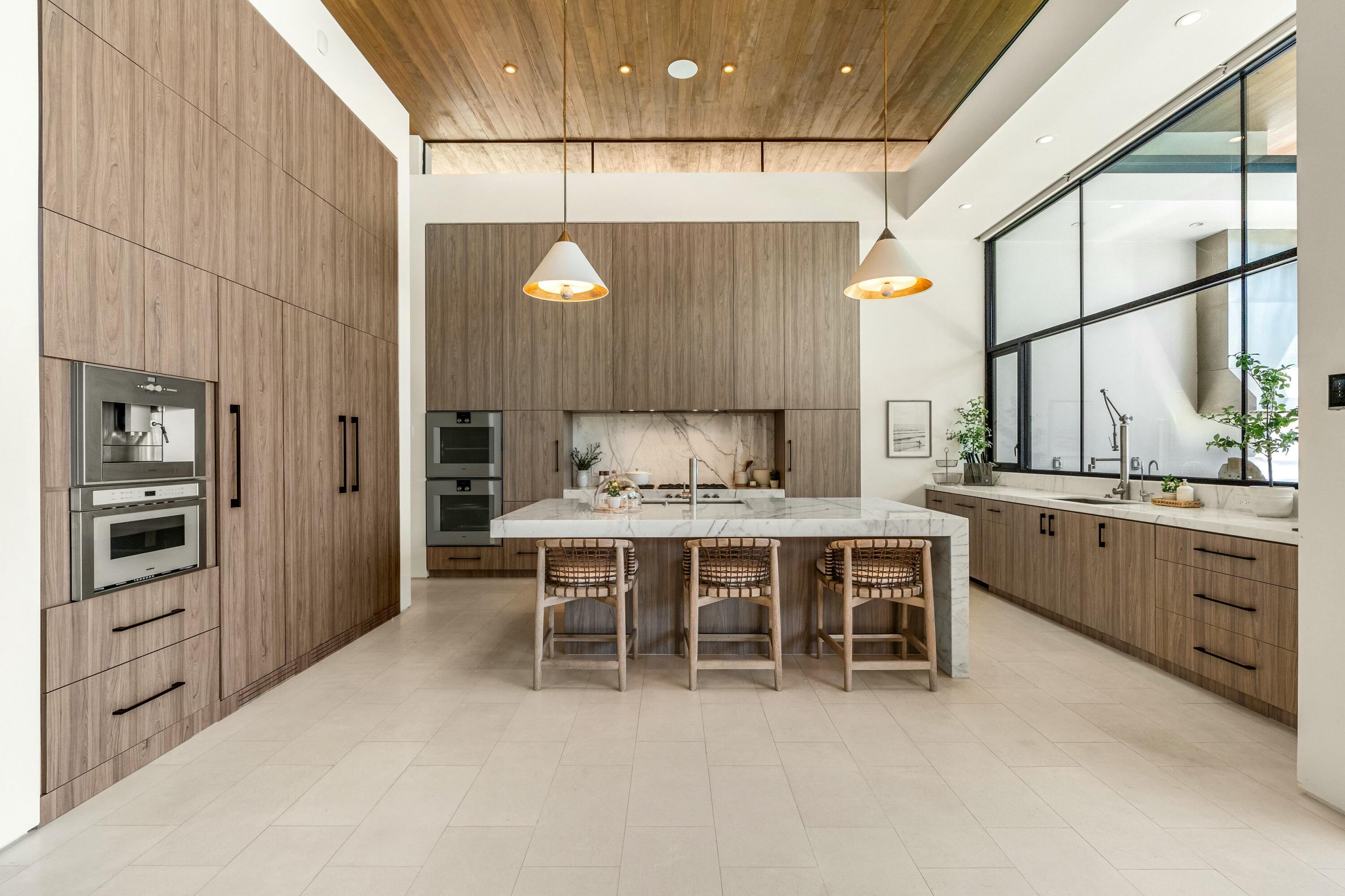 3 Makena Lane Rancho Mirage, CA 92270 - Photo 12 of 38 a kitchen with a table and chairs