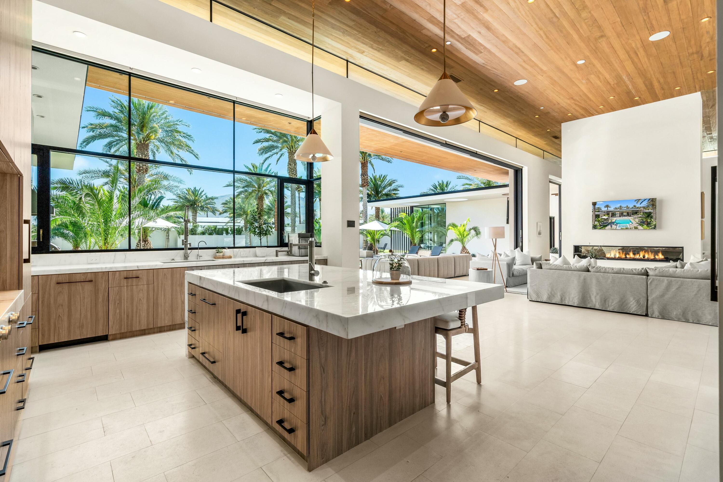 3 Makena Lane Rancho Mirage, CA 92270 - Photo 14 of 38 a kitchen with stainless steel appliances a sink and a large window