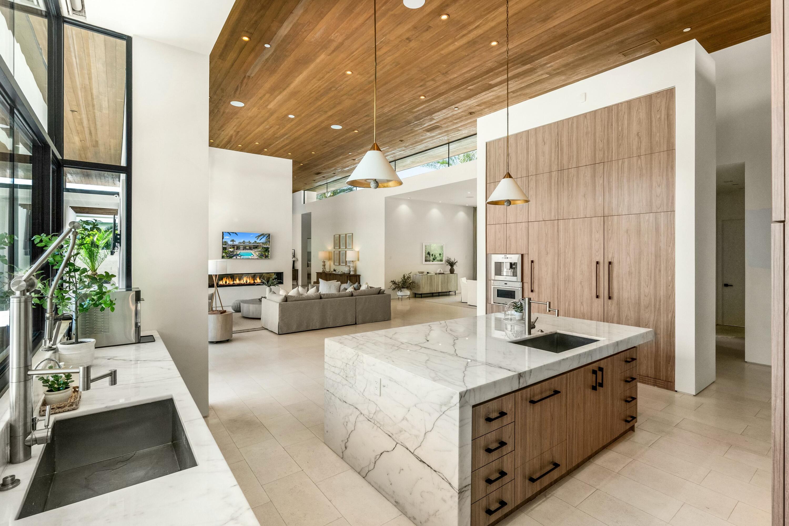 3 Makena Lane Rancho Mirage, CA 92270 - Photo 16 of 38 a kitchen with stainless steel appliances granite countertop a sink and a refrigerator