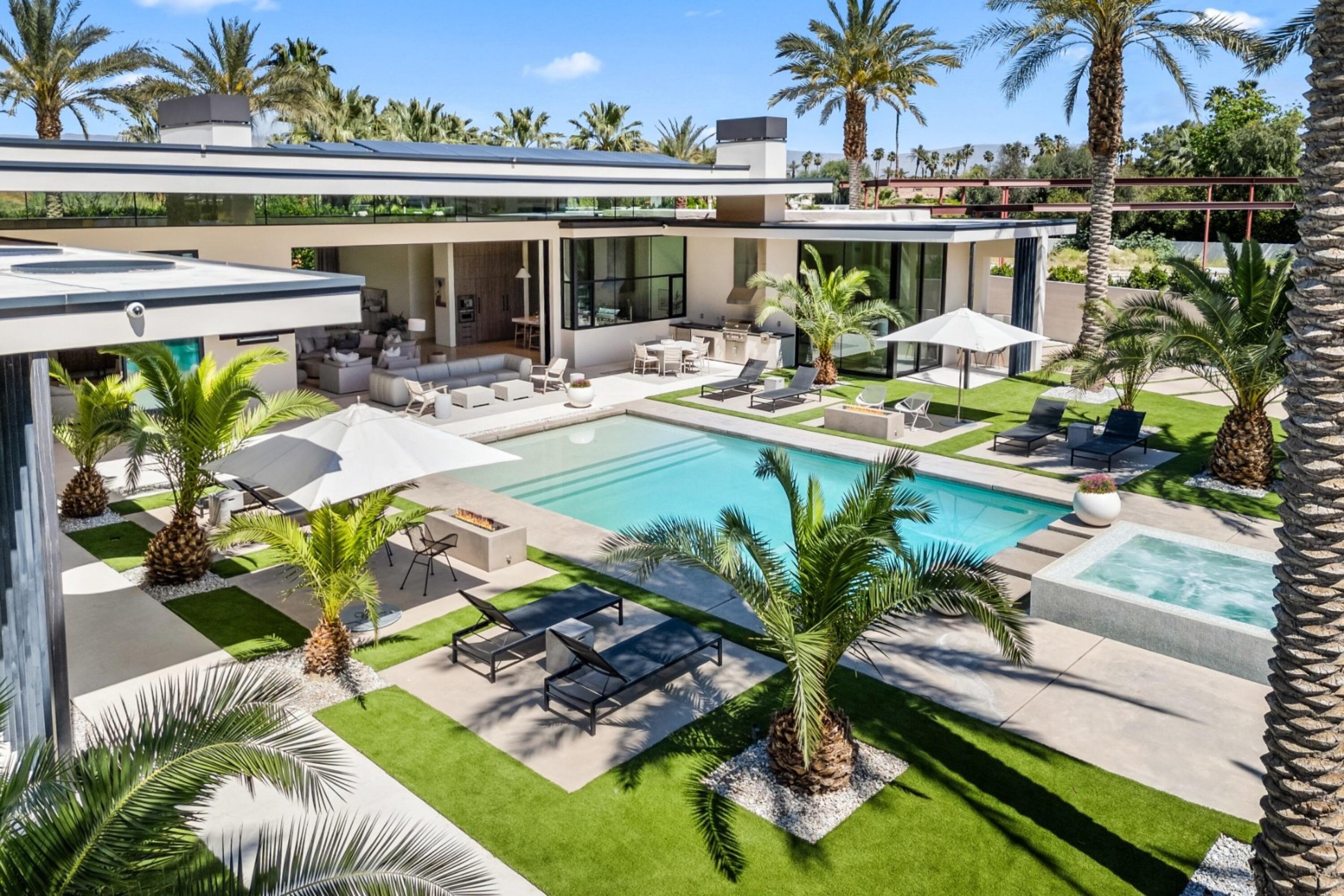 3 Makena Lane Rancho Mirage, CA 92270 - Photo 18 of 38 a view of a swimming pool with outdoor seating