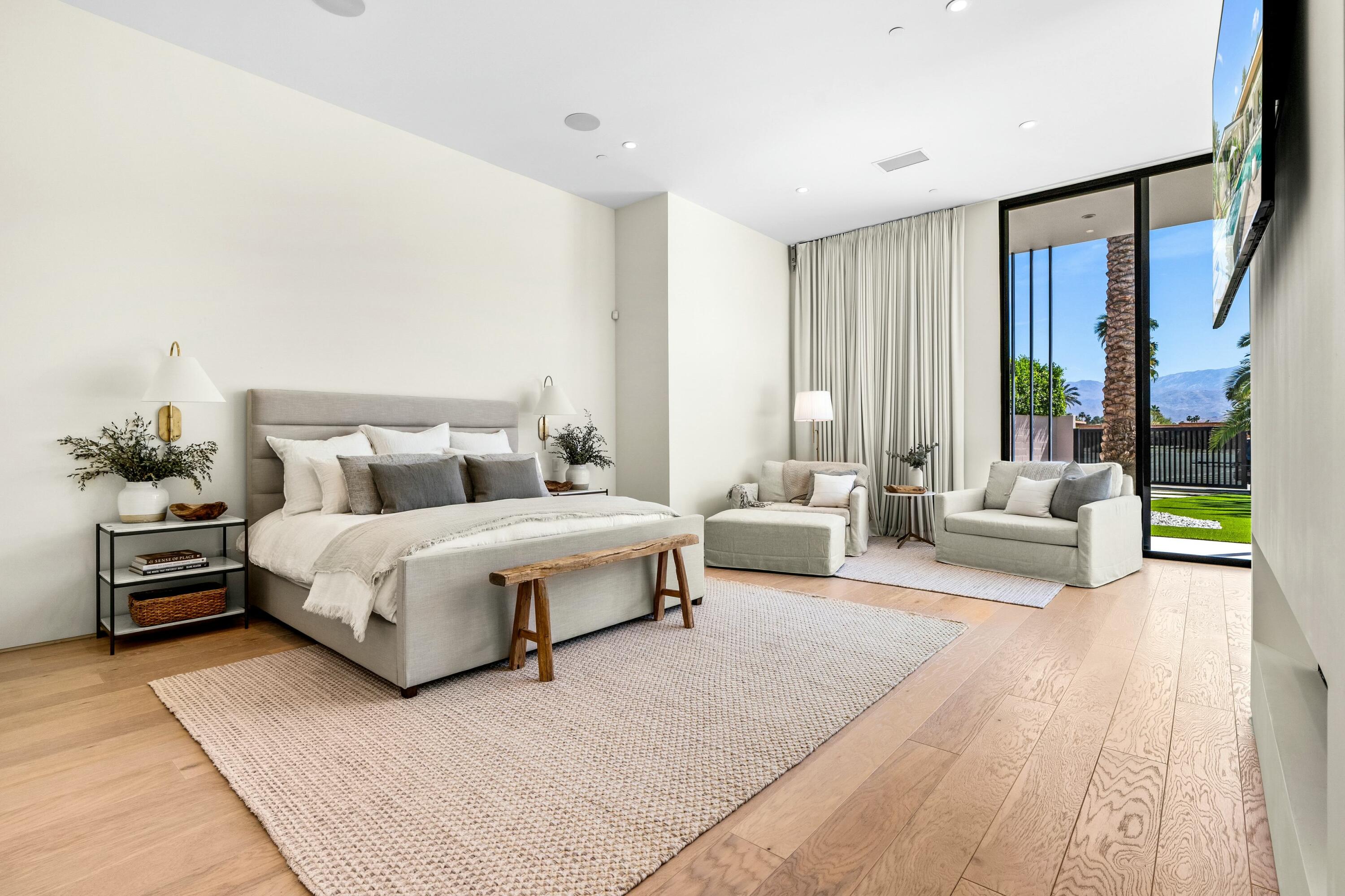 3 Makena Lane Rancho Mirage, CA 92270 - Photo 21 of 38 a bedroom with a large bed and a couch