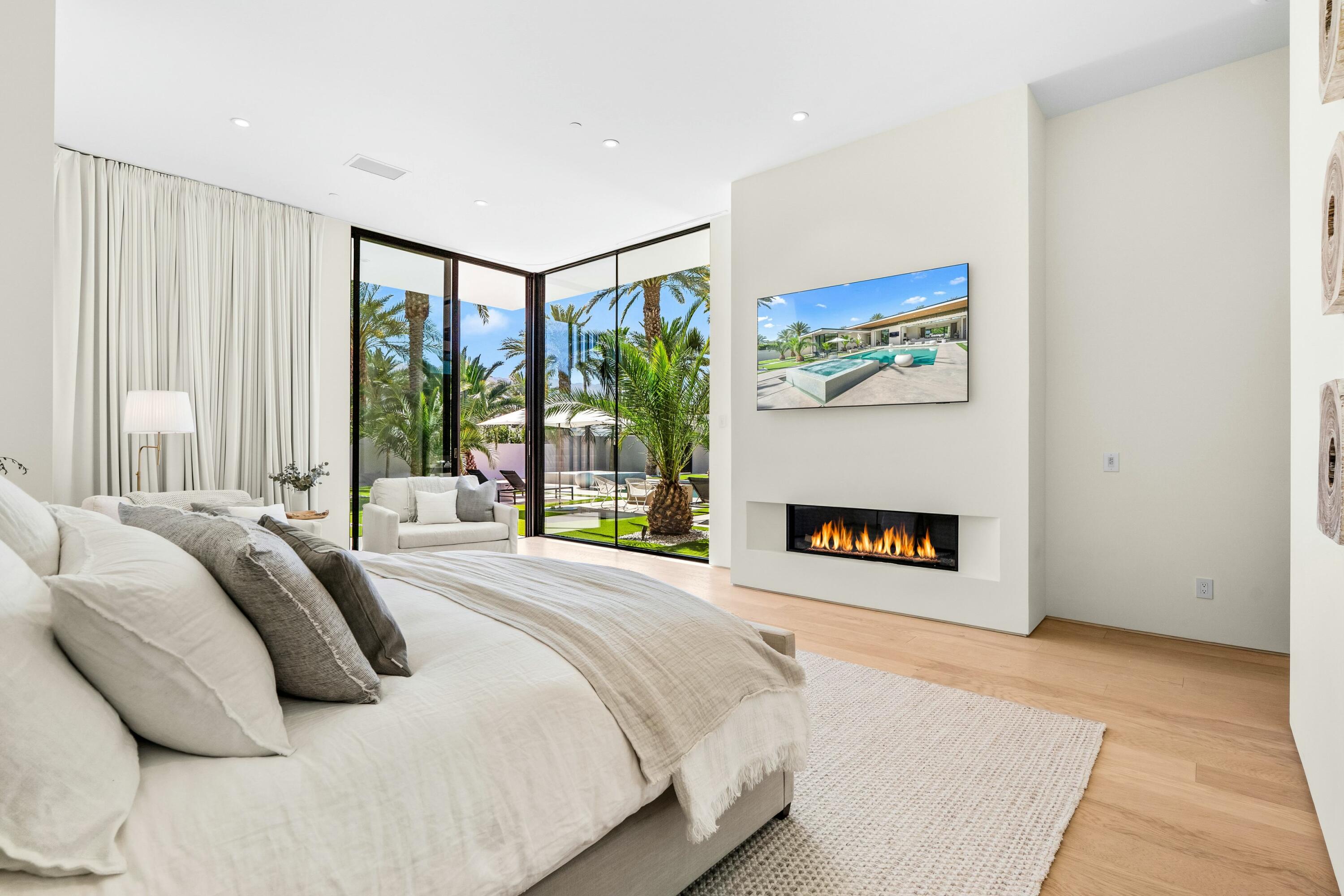 3 Makena Lane Rancho Mirage, CA 92270 - Photo 22 of 38 a bedroom with a bed and a painting on the wall