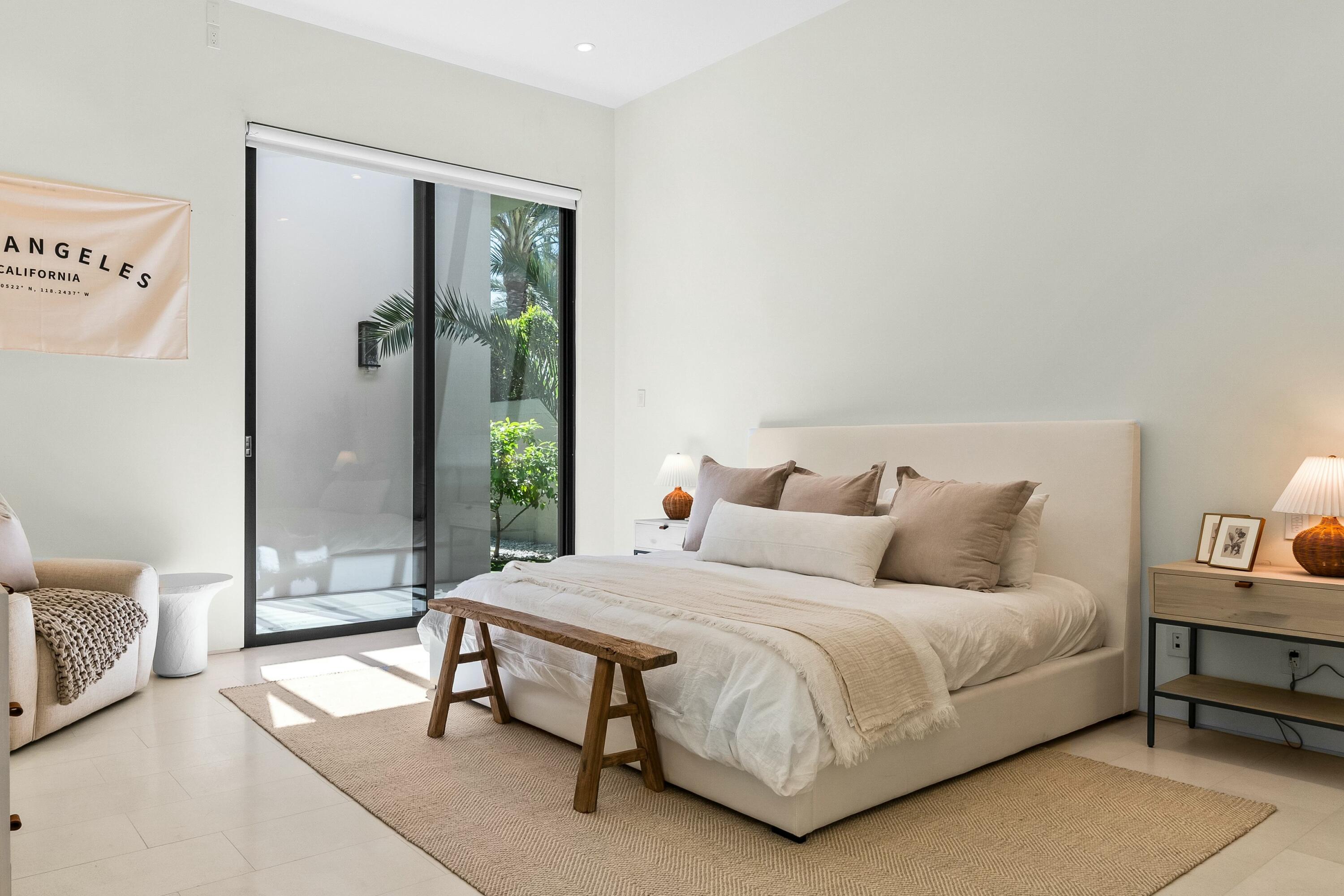 3 Makena Lane Rancho Mirage, CA 92270 - Photo 27 of 38 a bedroom with a bed table and a window