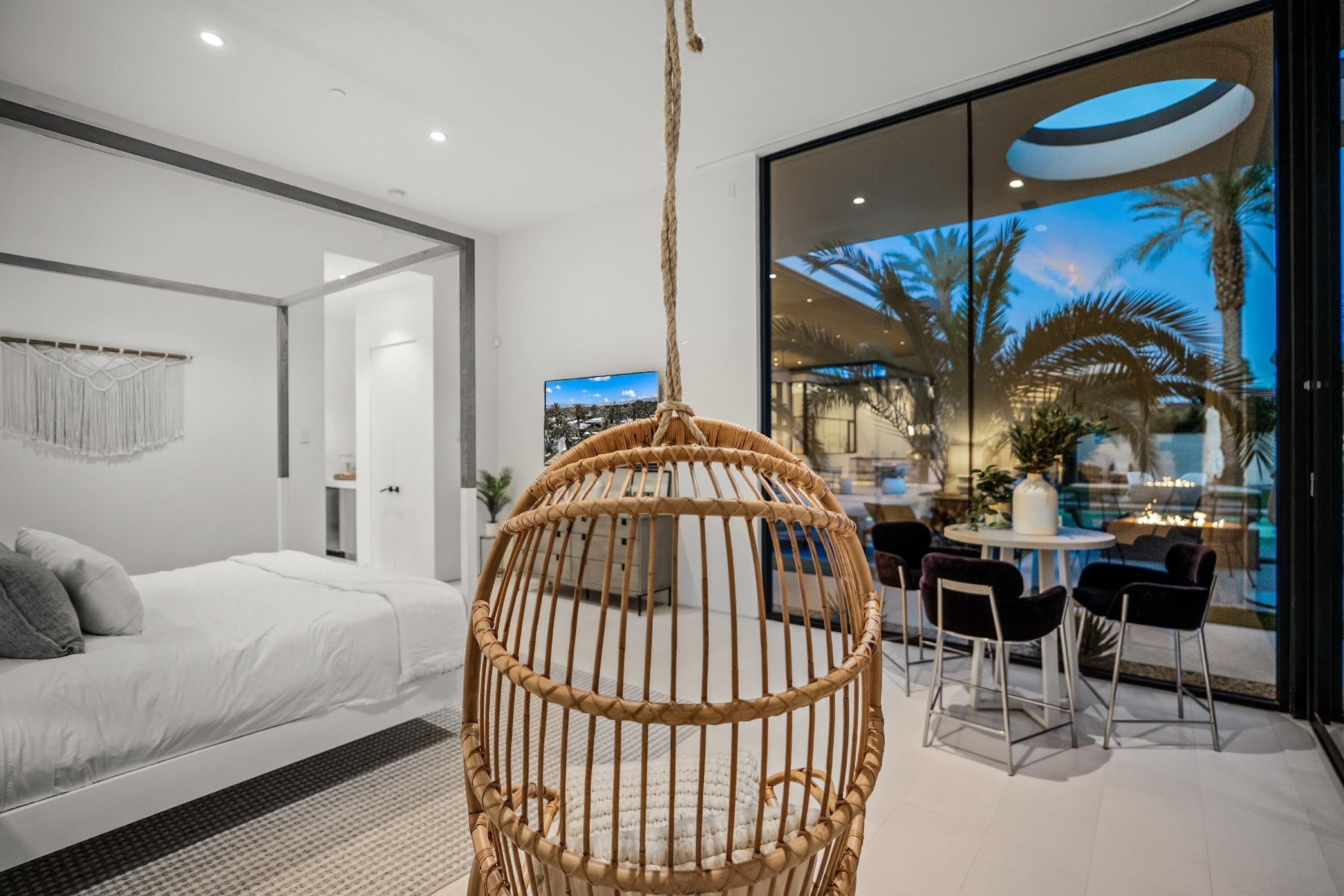 3 Makena Lane Rancho Mirage, CA 92270 - Photo 30 of 38 a bedroom with a bed and a painting on the wall