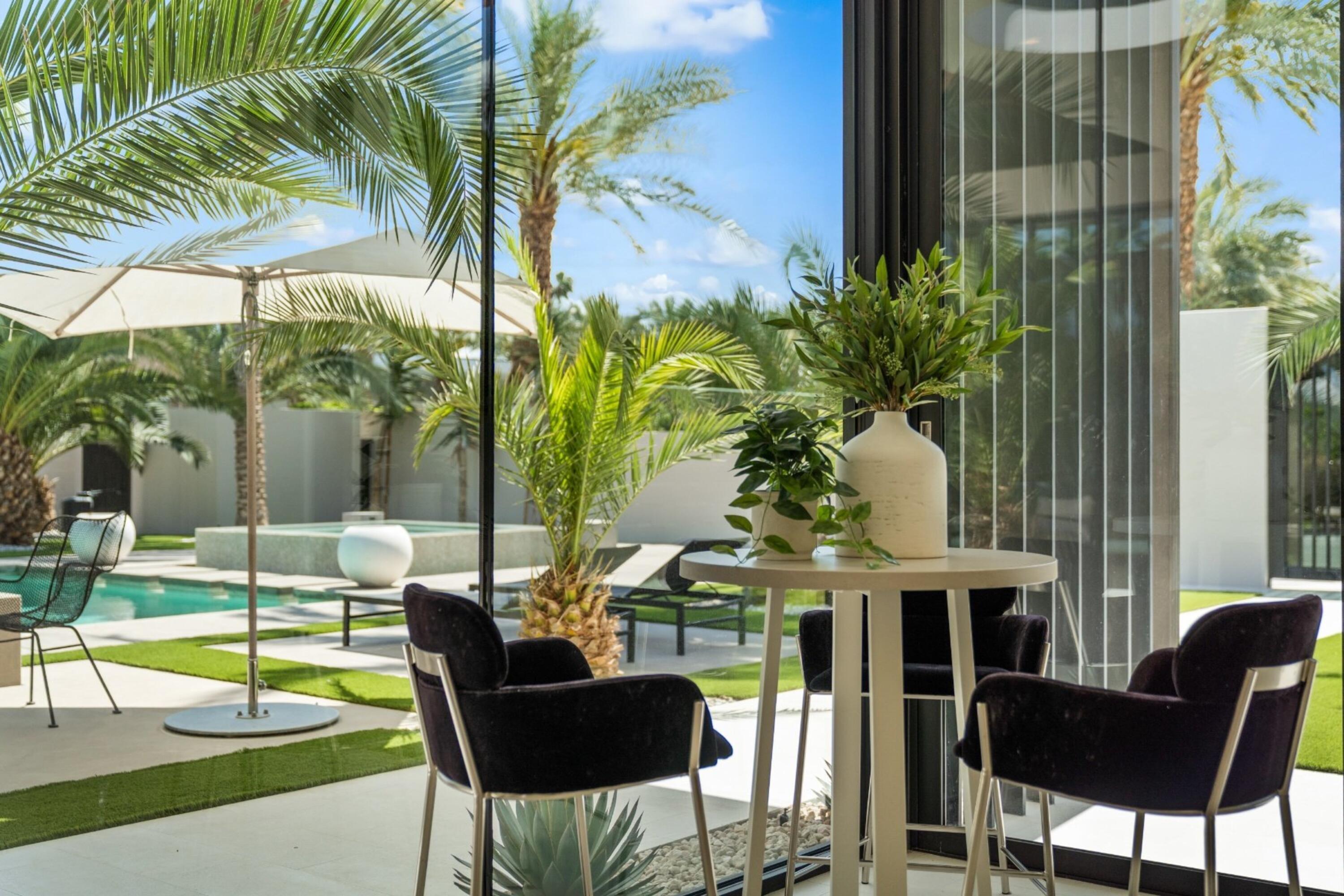 3 Makena Lane Rancho Mirage, CA 92270 - Photo 31 of 38 a view of a patio with table and chairs and potted plants