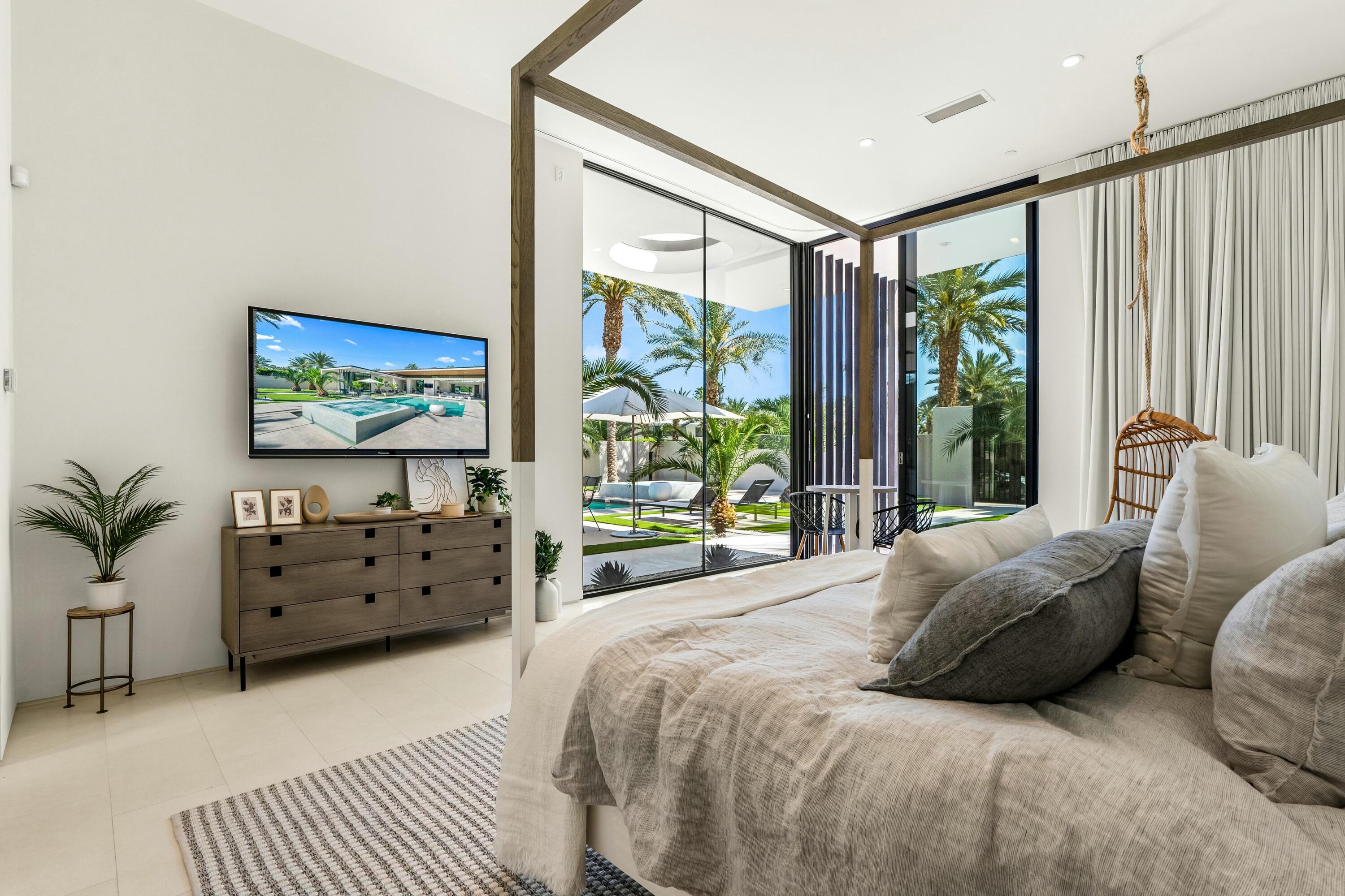 3 Makena Lane Rancho Mirage, CA 92270 - Photo 32 of 38 a bedroom with a bed and a large window