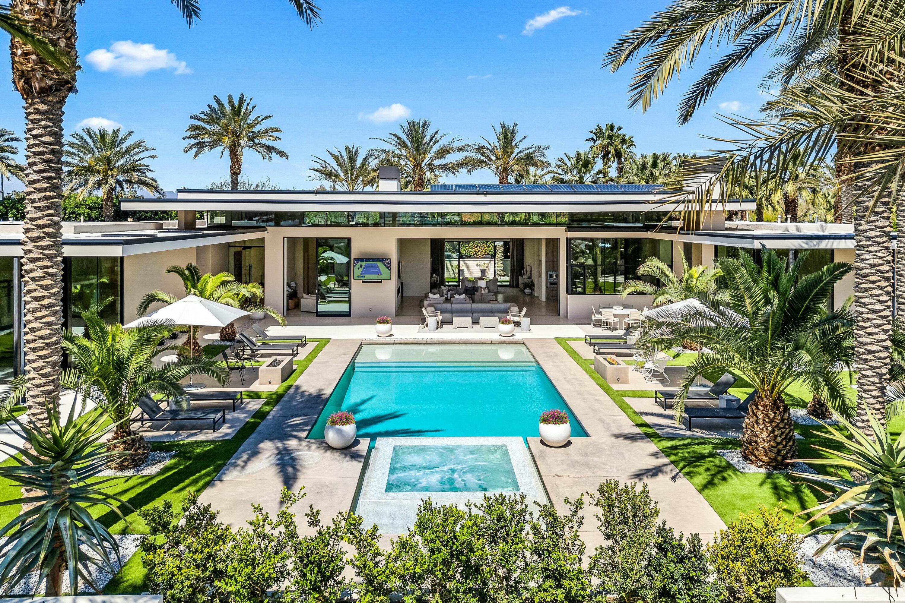 3 Makena Lane Rancho Mirage, CA 92270 - Photo 37 of 38 front view of a house with swimming pool and chairs