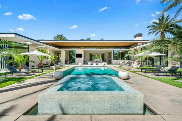 a view of a swimming pool with a patio