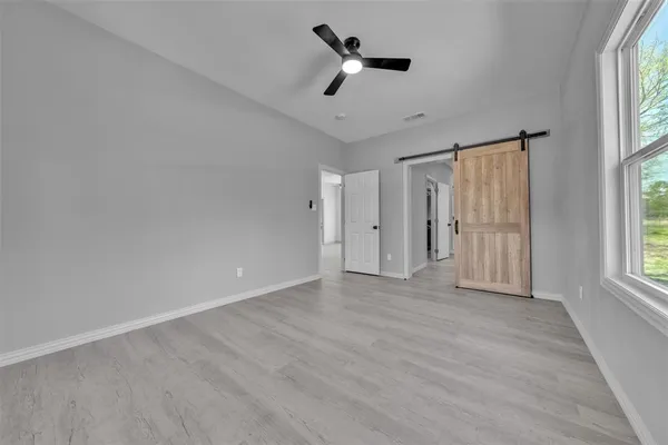 a view of an empty room with a window