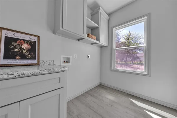 a view of cabinets and window