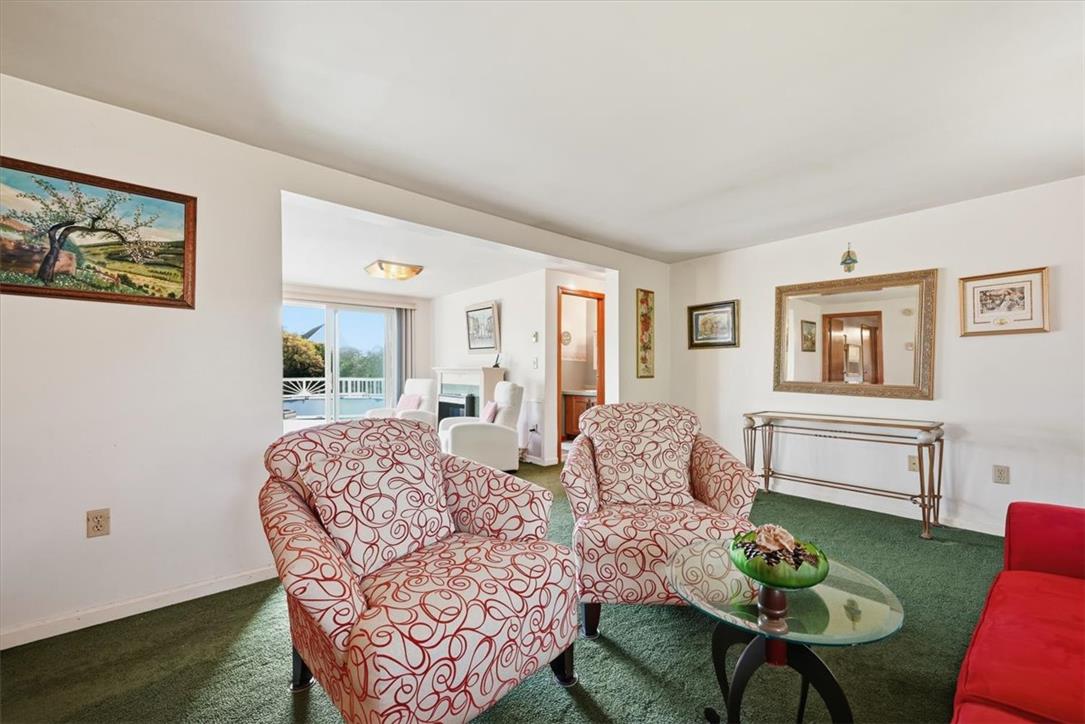 74 Swiss View Road Lehighton, PA 18235 - Photo 5 of 59 An open doorway connects the cozy carpeted living space to an adjacent sitting room.