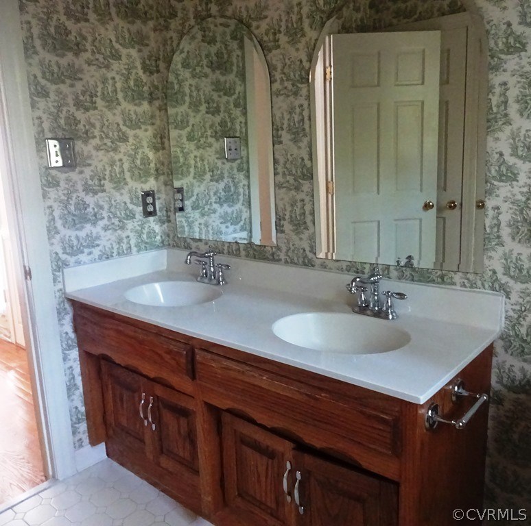 5801 Deep Forest Road Chester, VA 23831 - Photo 17 of 50 a bathroom with a sink and a mirror