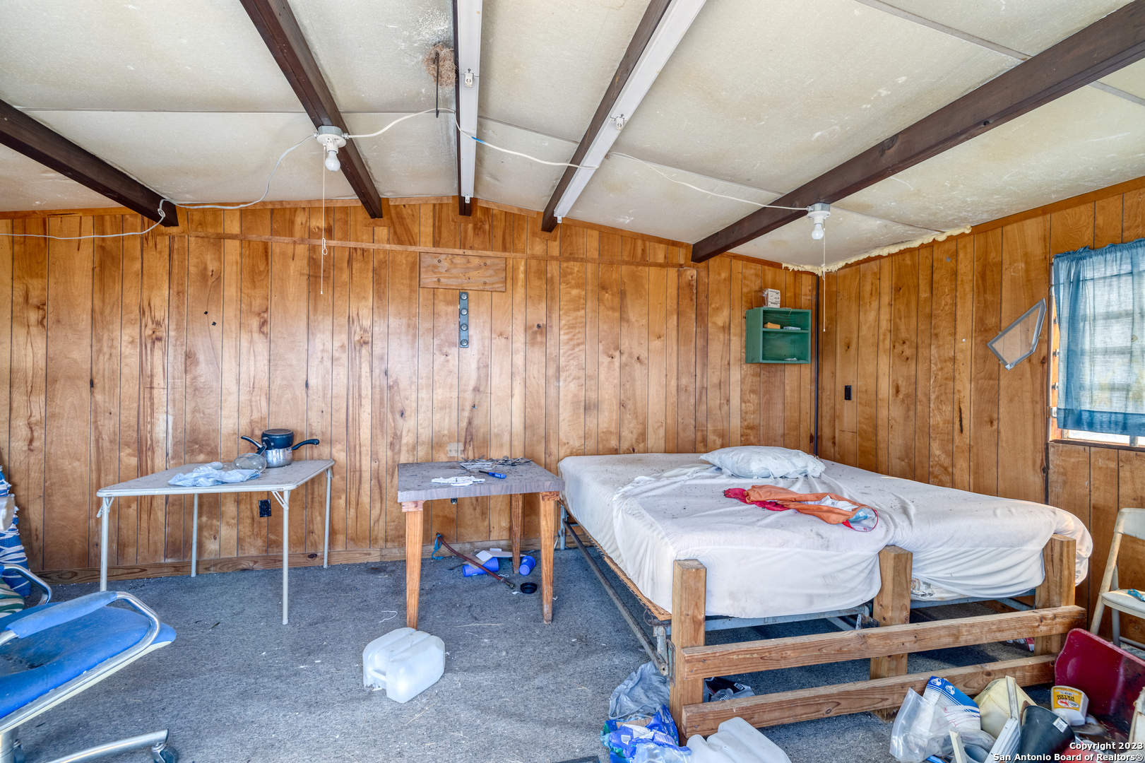 1917 Ranch Road 3348 Brackettville, TX 78832 - Photo 12 of 25 a bedroom with a bed a table and chair