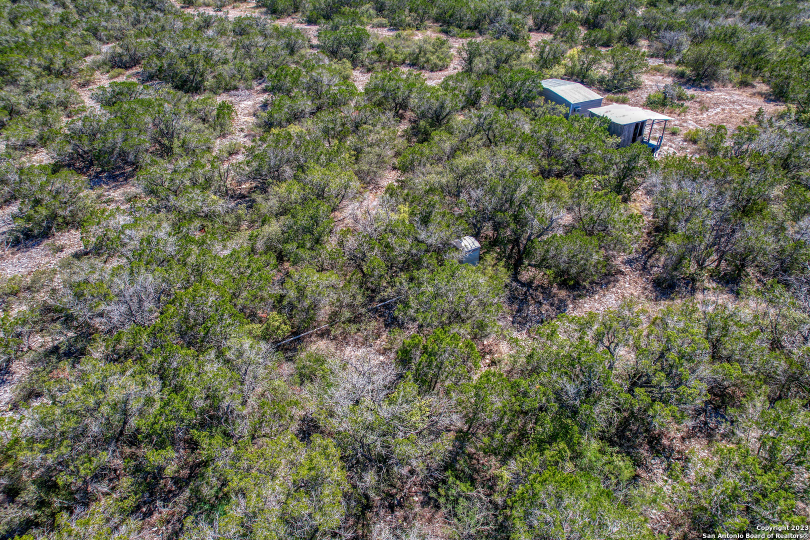 1917 Ranch Road 3348 Brackettville, TX 78832 - Photo 5 of 25 an aerial view of residential house with outdoor space and trees all around