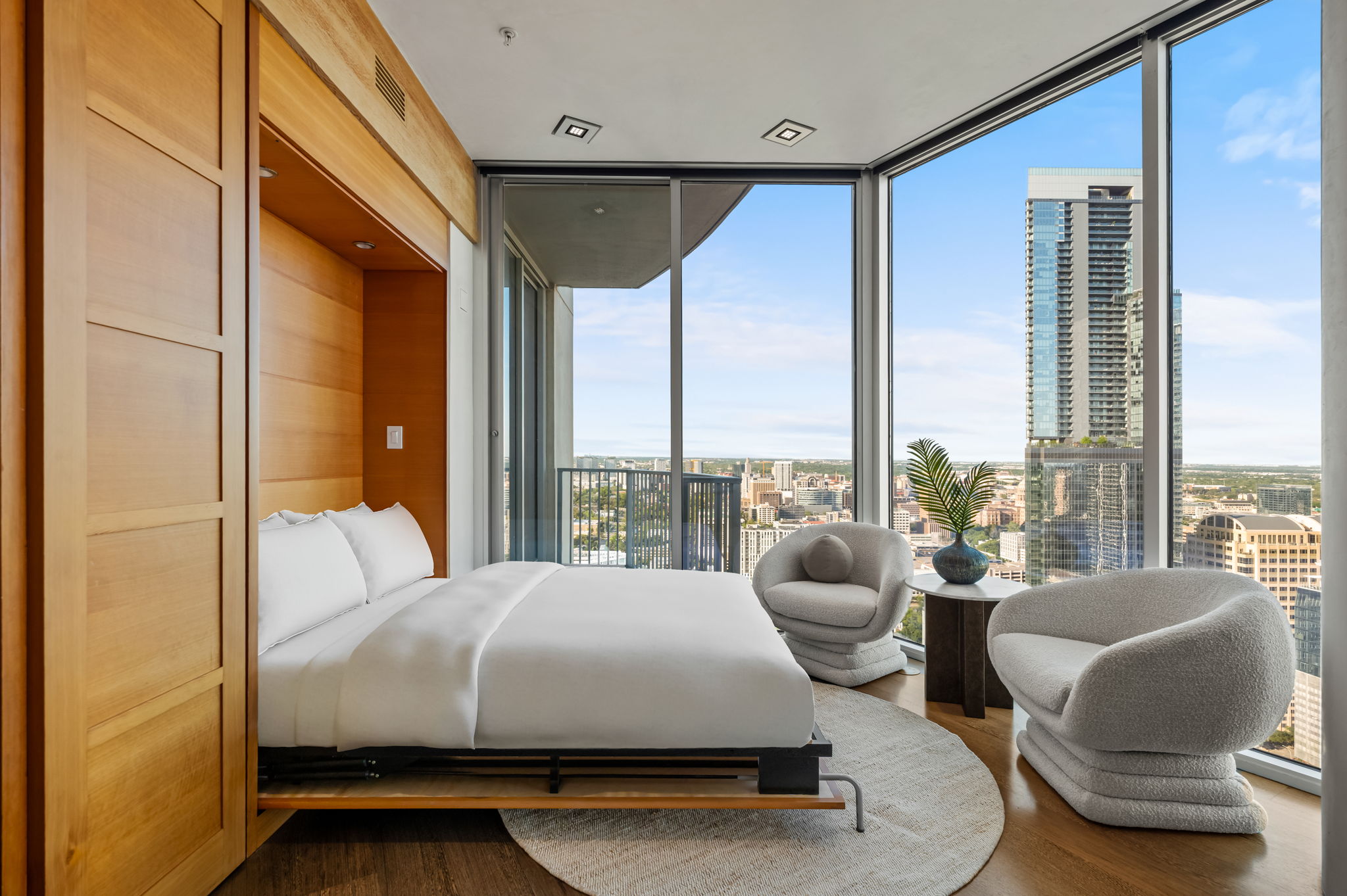360 Nueces Street, Unit 4211 Austin, TX 78701 - Photo 29 of 40 a bedroom with a bed and large windows