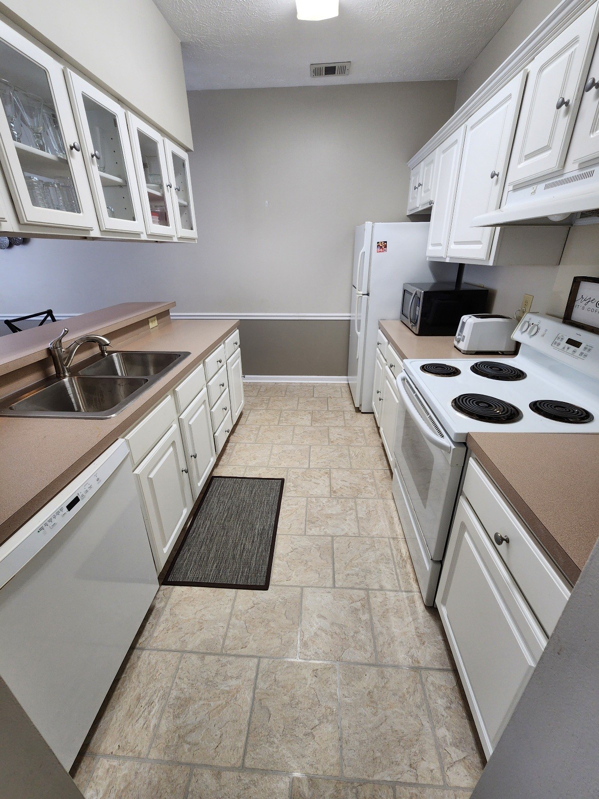 910 Churchill Crossing Madison, TN 37115 - Photo 13 of 38 a kitchen that has a sink and a stove