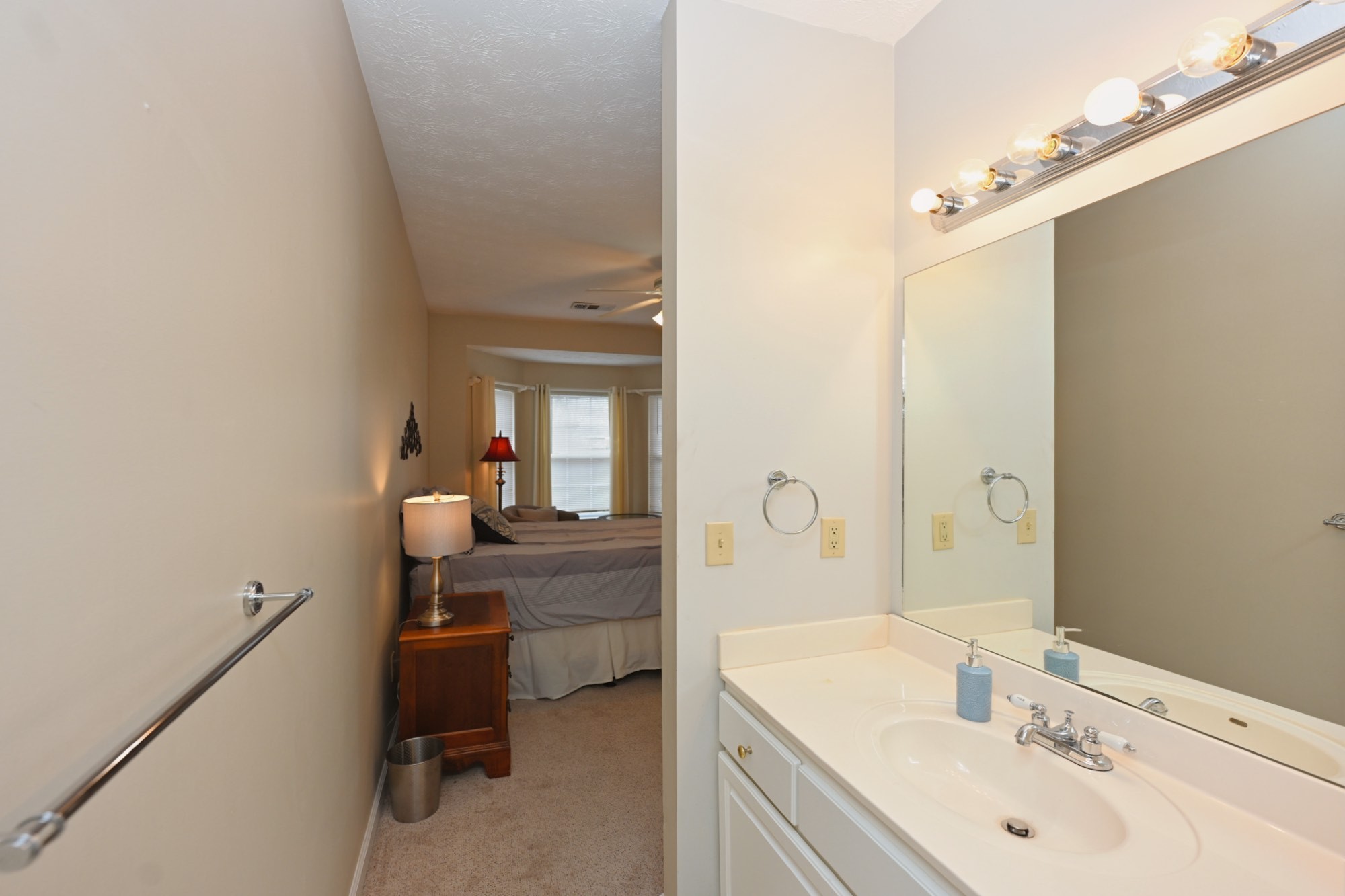 910 Churchill Crossing Madison, TN 37115 - Photo 21 of 38 a en suite bathroom with a granite countertop sink and a mirror