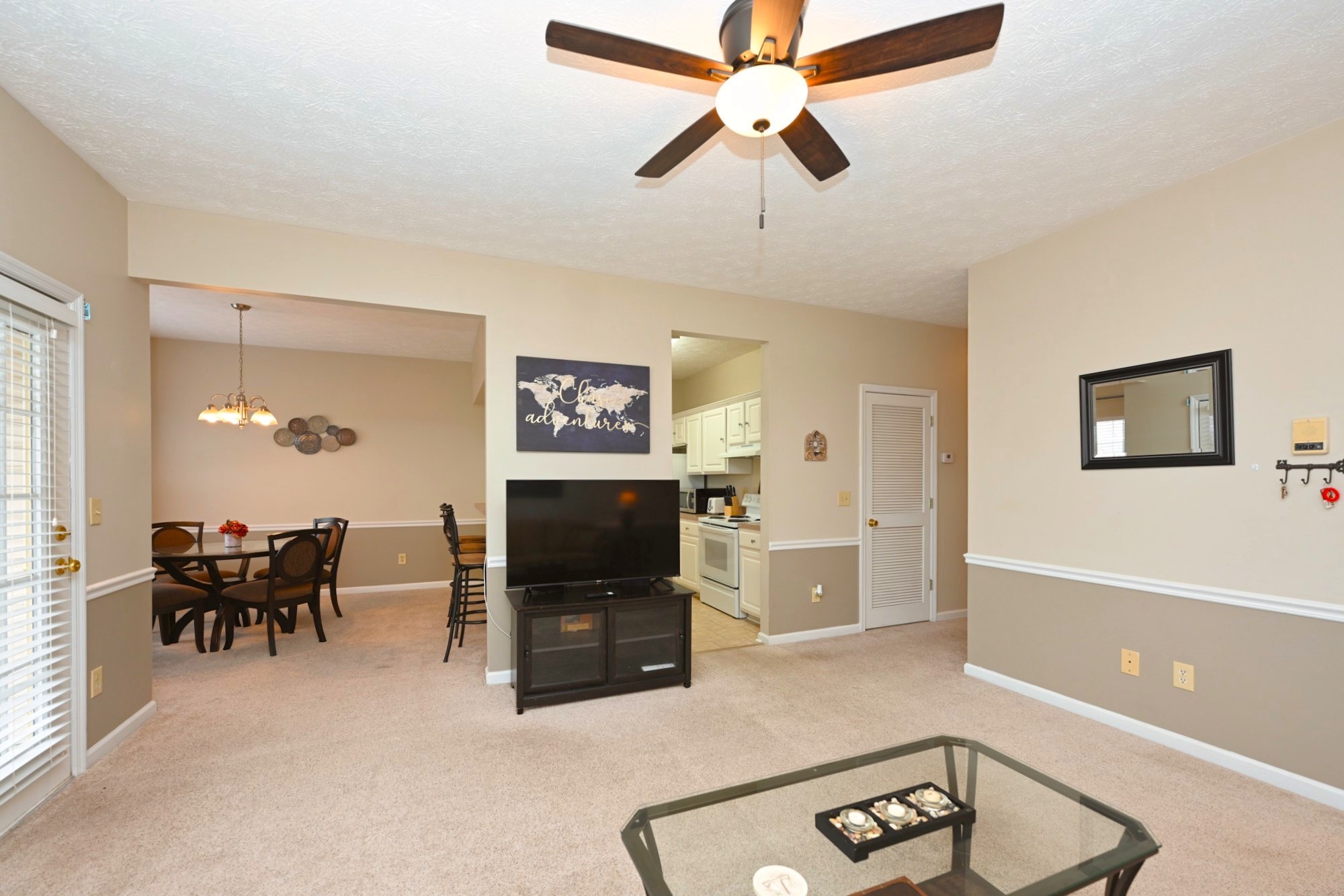 910 Churchill Crossing Madison, TN 37115 - Photo 4 of 38 a living room with furniture a dining table and a fireplace
