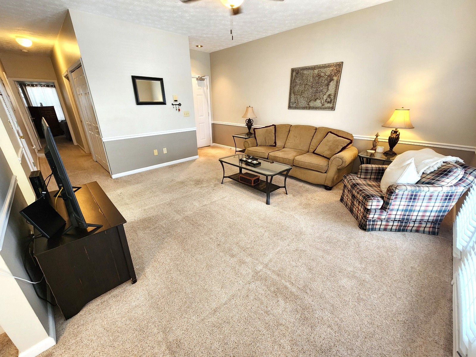 910 Churchill Crossing Madison, TN 37115 - Photo 5 of 38 a living room with furniture and a flat screen tv