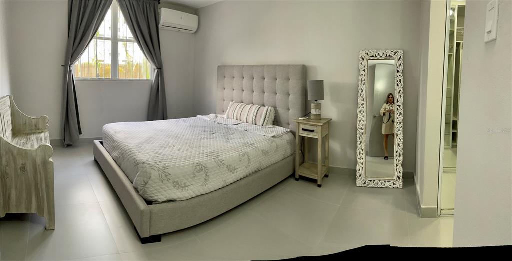 290 Av. Sta. Ana Guaynabo, Bayamón 00969 - Photo 13 of 23 a bath room with a bed and a window