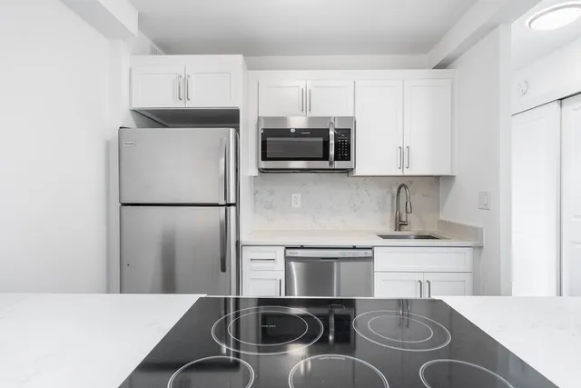 a bathroom with a toilet sink and shower