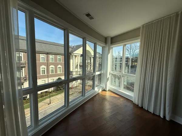 a view of an entryway with a floor to ceiling window