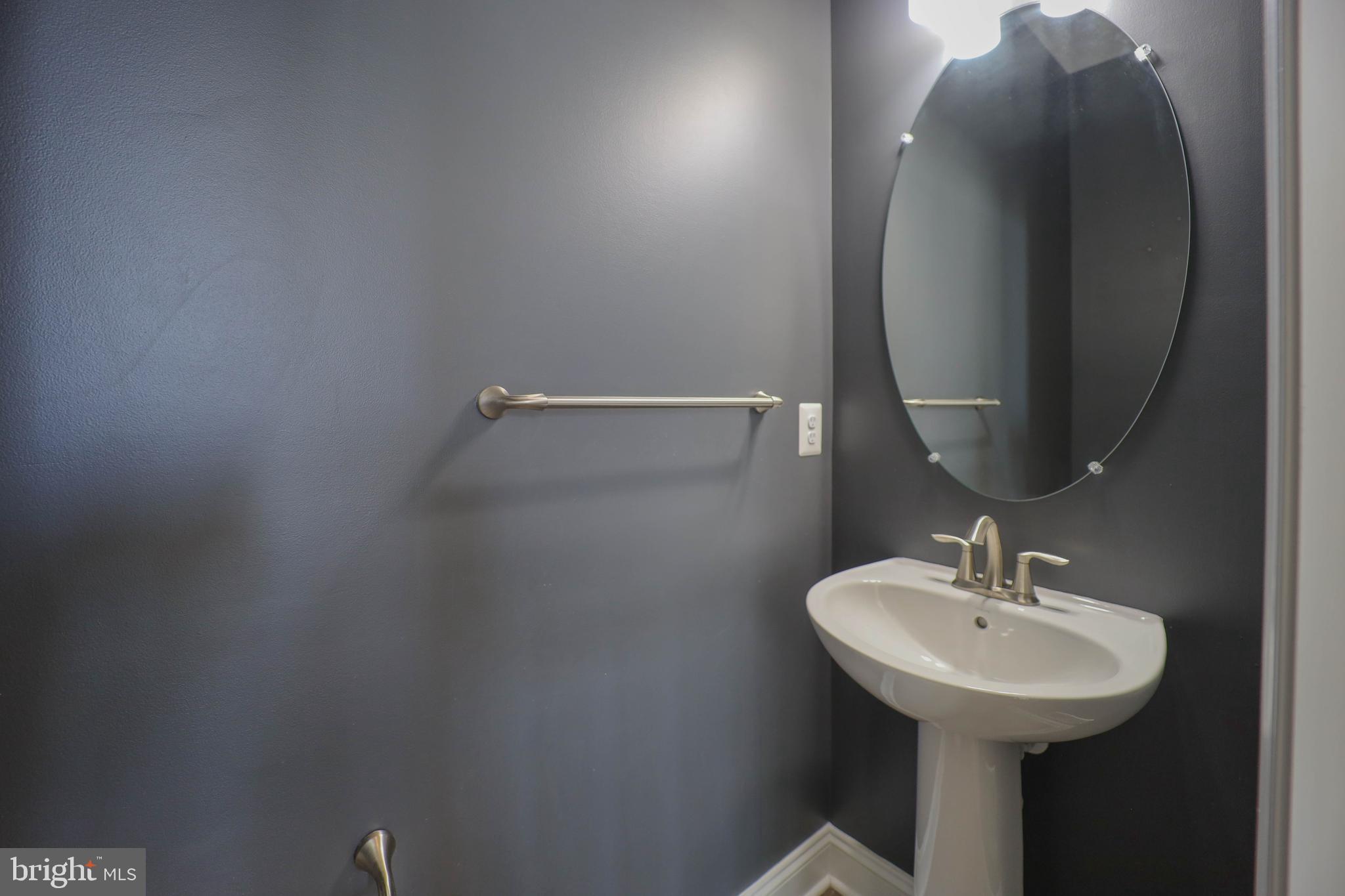 5054 Judicial Way Frederick, MD 21703 - Photo 14 of 28 a bathroom with a sink and mirror