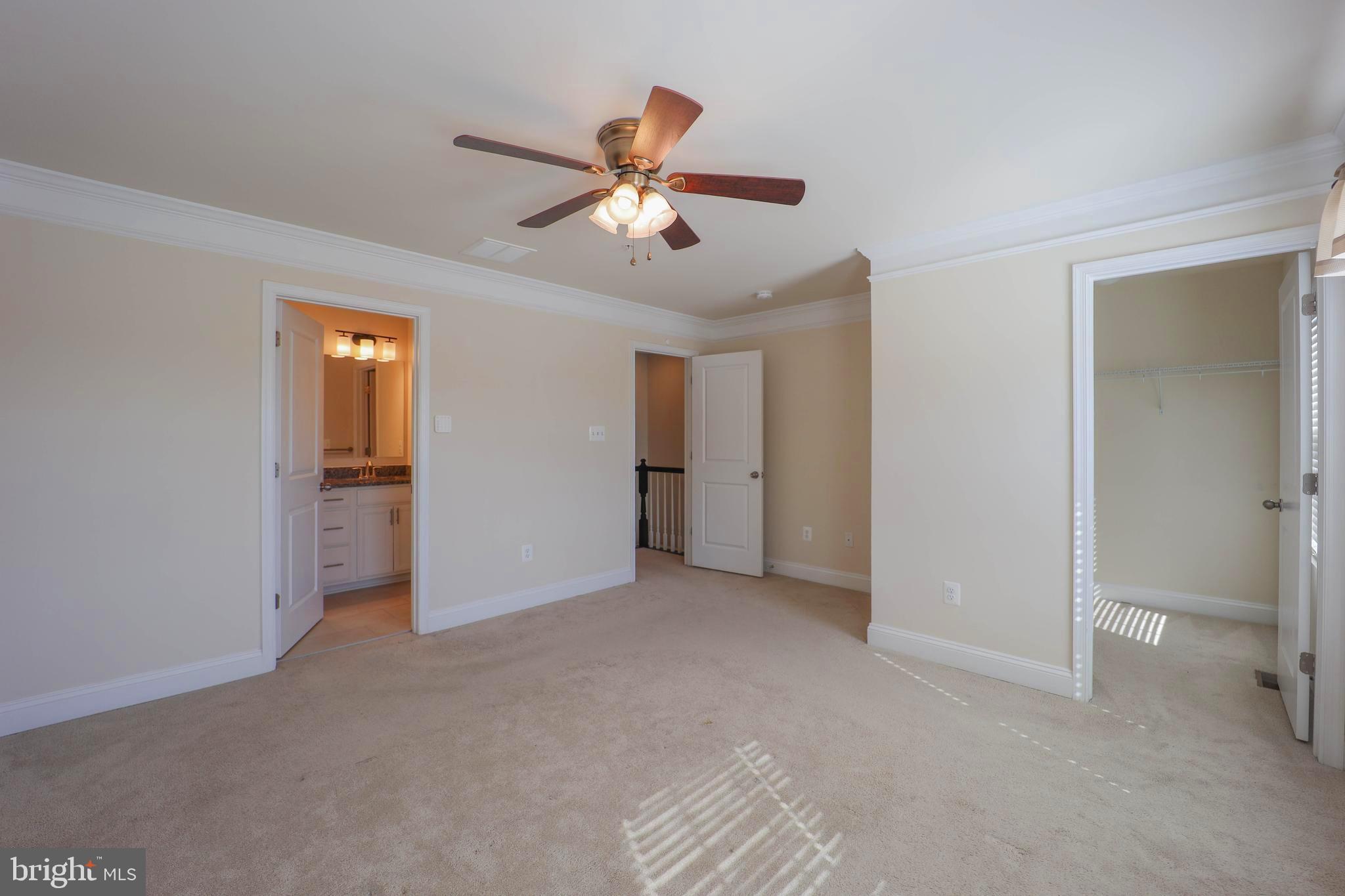 5054 Judicial Way Frederick, MD 21703 - Photo 17 of 28 a view of an empty room with a ceiling fan