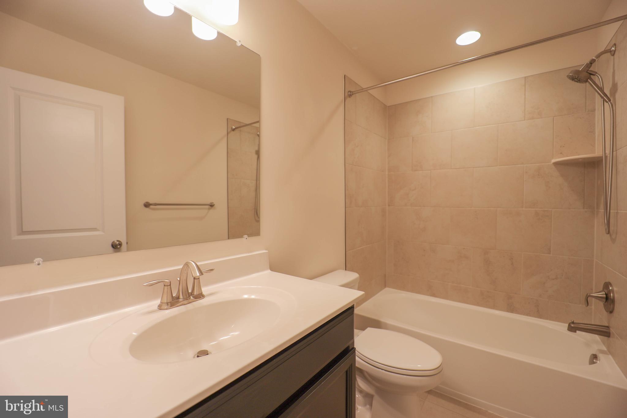 5054 Judicial Way Frederick, MD 21703 - Photo 24 of 28 a bathroom with a sink toilet tub and shower