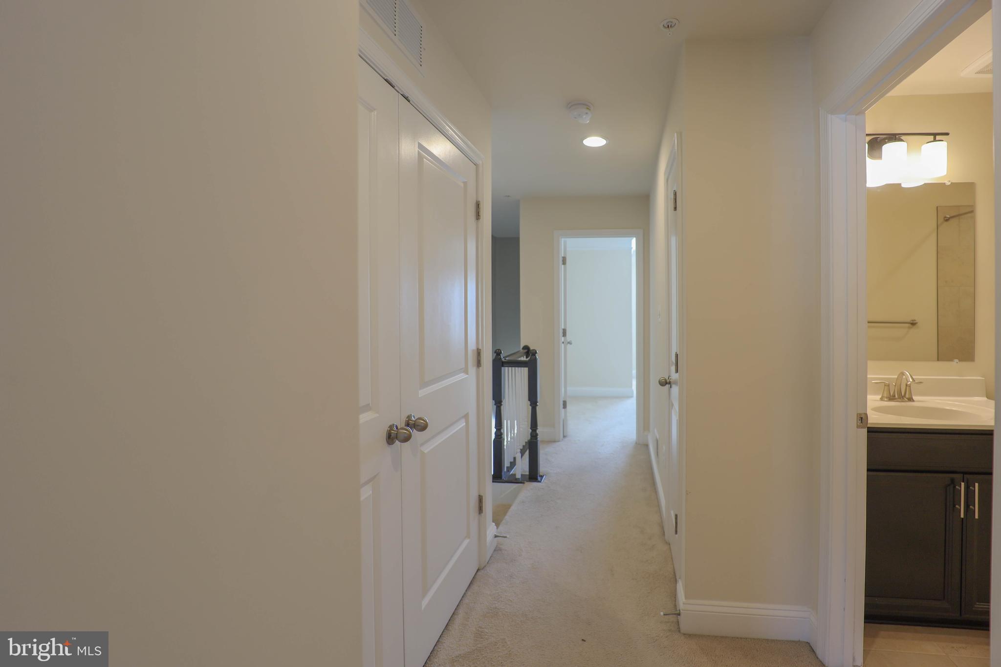 5054 Judicial Way Frederick, MD 21703 - Photo 25 of 28 a bathroom with a shower and a sink