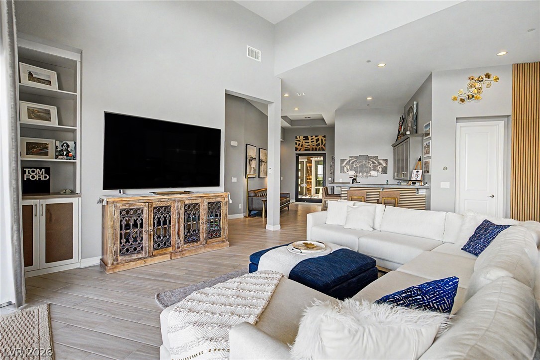 6014 Willow Ridge Court Las Vegas, NV 89135 - Photo 19 of 99 This living room features high ceilings and sleek tile flooring.