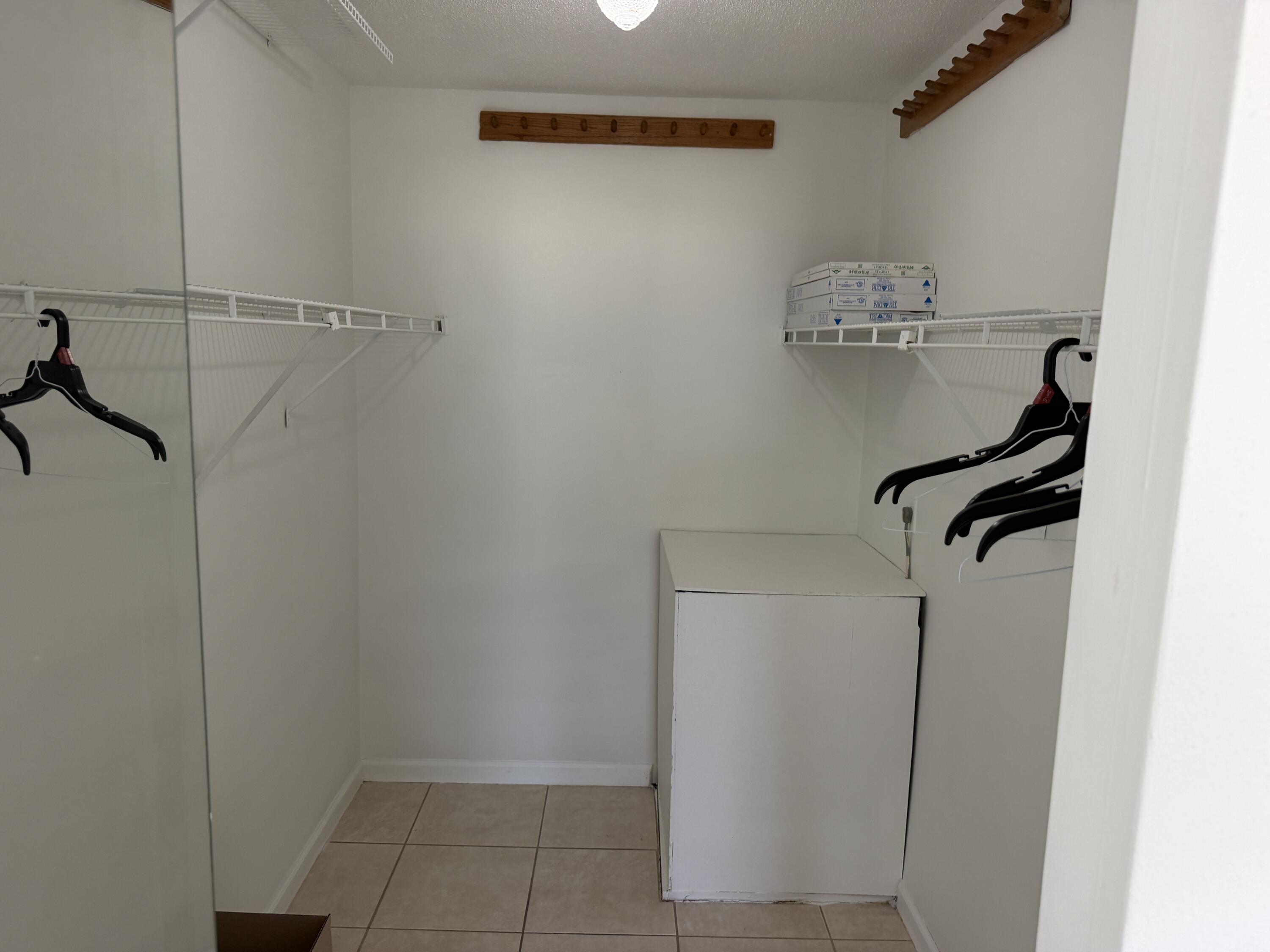 506 Davis Road, Unit 70 Palm Springs, FL 33461 - Photo 22 of 25 a view of small space with racks on the wall